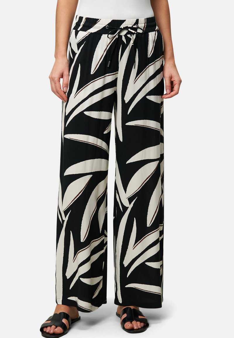 Pantaloni a gamba larga neri e crema con un grande motivo a foglia, vita elastica con cordino e tessuto leggero.