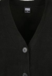 Cardigan en tricot noir avec un col en V, une texture côtelée et trois boutons noirs sur le devant. L'étiquette indique "URBAN CLASSICS", taille XS.