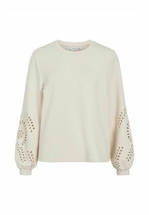 Sweatshirt crème avec de longues manches bouffantes. Présente des motifs floraux découpés sur les manches. Fabriqué en tissu doux et texturé. Col rond.