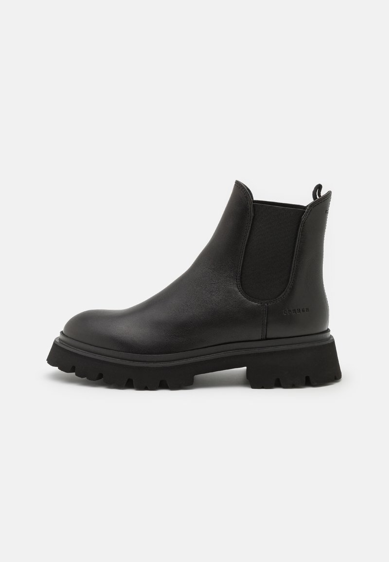 Bottes Chelsea en cuir noir avec panneaux latéraux élastiques, bout rond et semelle en caoutchouc robuste dotée d'un profond profil pour une meilleure traction.