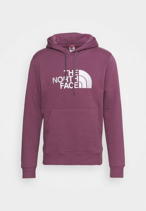 Paarse pullover met capuchon, voorvak, trekkoord en wit "THE NORTH FACE" logo op de borst.