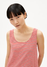 Red and white striped tank top with a scoop neckline and sleeveless design, made from a smooth fabric. Simple pattern, no additional accents.