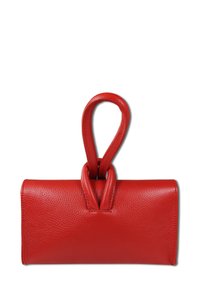 Red leather handbag with a smooth texture, featuring a unique looped handle and a rectangular shape. Simple design with no embellishments.