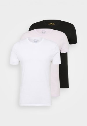 Trois T-shirts à manches courtes en blanc, rose et noir, fabriqués en coton avec des cols ronds et un design minimaliste.
