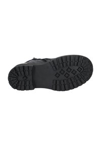 Suela de zapato de goma negra con patrones de tracción profundos y surcos. Presenta áreas del talón y la punta reforzadas para mayor durabilidad.