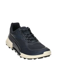 Navy athletic shoe with a textured mesh upper, rubber sole, and contrasting ivory outsole. Features laces and reinforced side accents.
