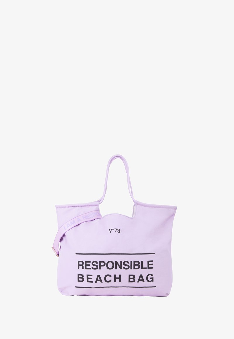 Bolso de lona lavanda con dos asas, que presenta el texto "BOLSO DE PLAYA RESPONSABLE" y "SOY UN RESPONSABLE" en la correa en negro.