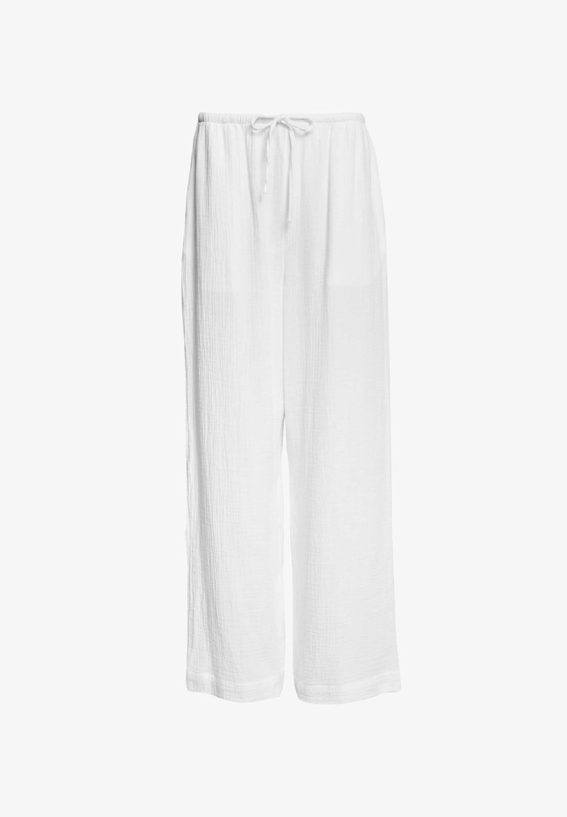 Pantalons blancs, légers et amples en tissu texturé. Taille élastique avec cordon de serrage réglable et poches latérales.