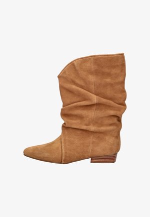 Mid-height brown suede slouchy boot with pointed toe and low stacked wooden heel, shown in side profile on white background.