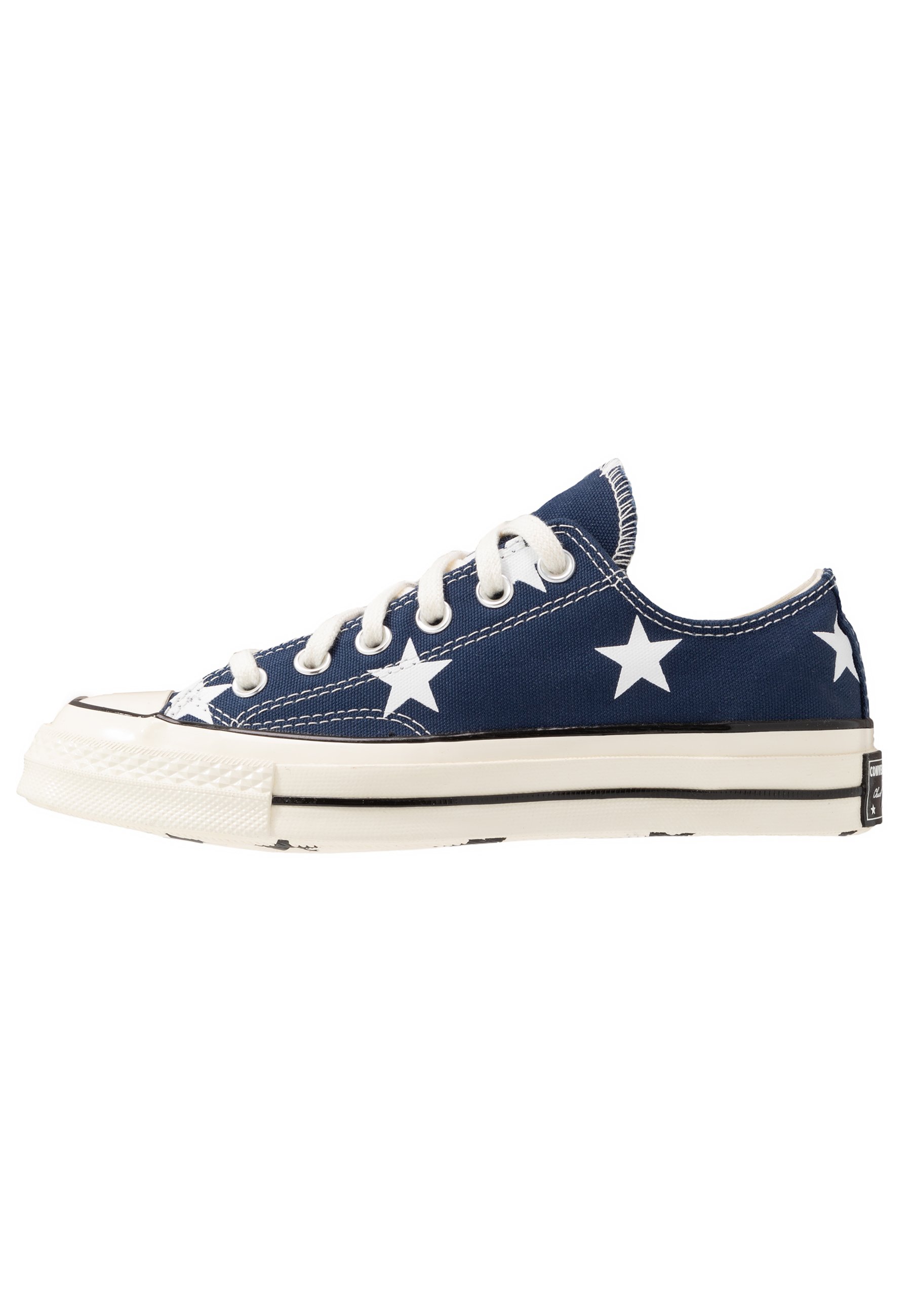 who designed the converse all star trainer