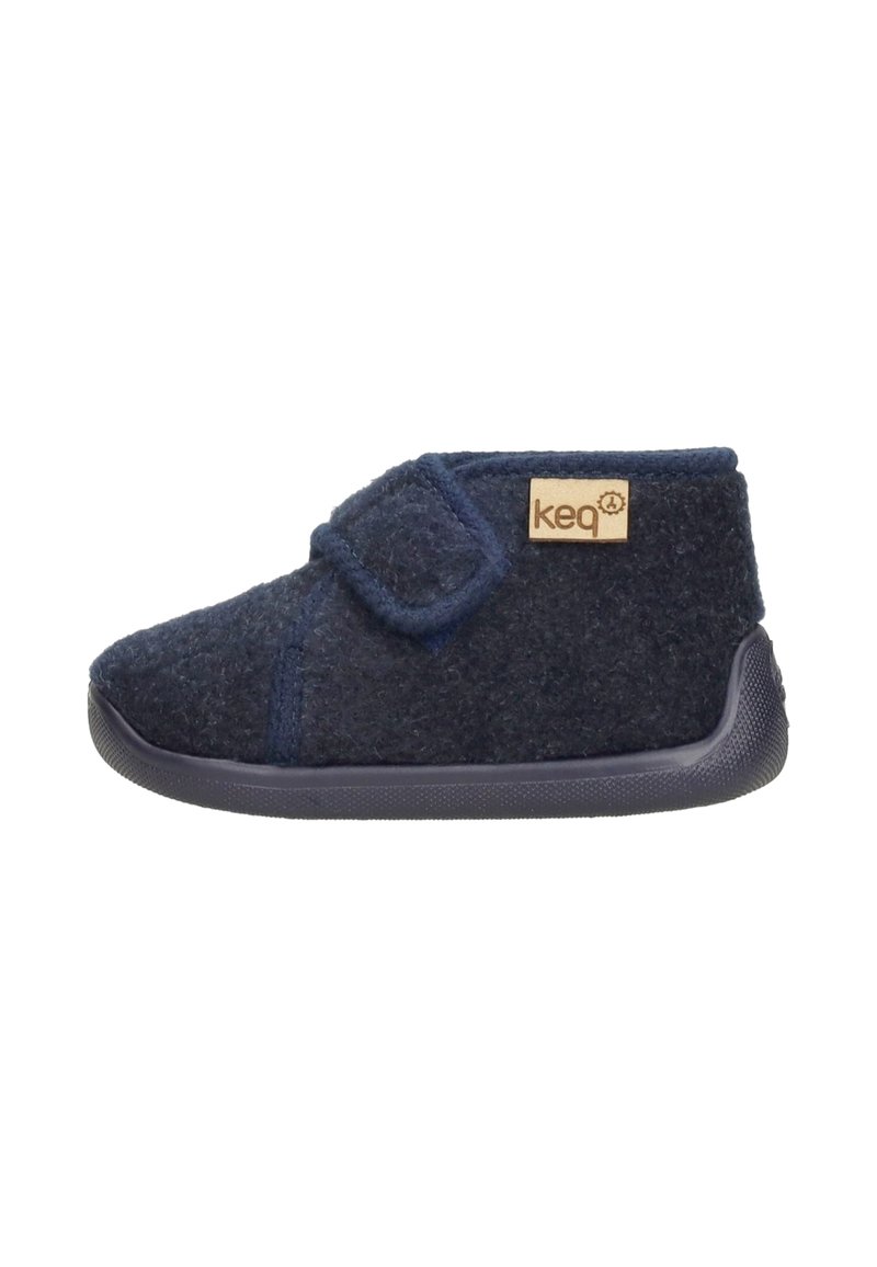 Wool felt slipper in dark navy with a soft texture, Velcro strap, and rubber sole featuring dotted traction for grip.
