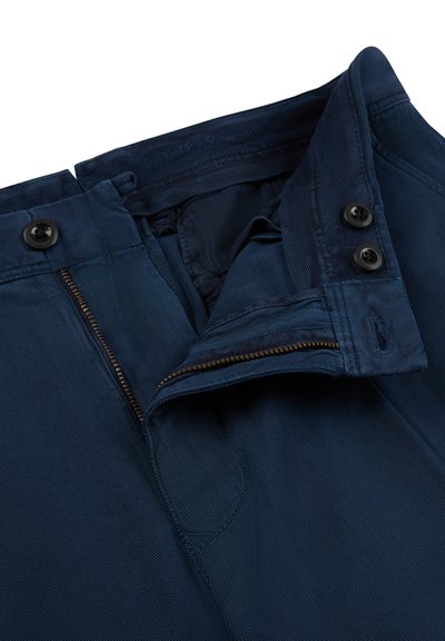 Navy blue trousers with zipper fly, double button closure, and visible stitching, shown partially open on a white background.