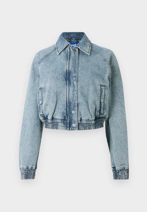 Cropped denim jacket in light washed blue, featuring a snap front closure, side pockets, and elasticated waist and cuffs.
