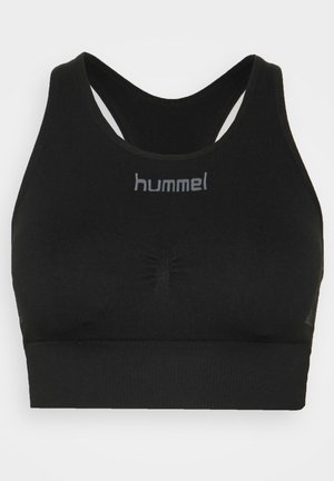 Black sports bra with crisscross strap design, textured band, and subtle logo at the front. Made from stretchable, breathable fabric.