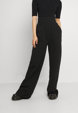 K AND K FLARE HIGH RISE - Verryttelyhousut - black