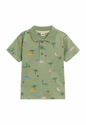 Polo vert en coton à manches courtes, arborant divers motifs colorés de dinosaures et de plantes. Patte de boutonnage à trois boutons au col.