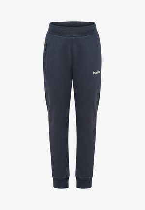 Marineblauwe taps toelopende joggingbroek met elastische tailleband, ritssluiting aan de zijkant, omgeslagen enkels en klein "hummel" logo op de rechterdij.