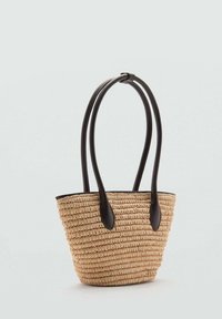 Wiklinowa torba typu tote z dwoma ciemnobrązowymi rączkami z syntetycznej skóry, charakteryzująca się zaokrąglonym kształtem i otwartym górnym wykończeniem.