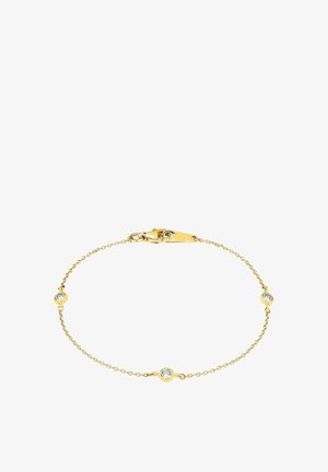 Pulsera de cadena de oro con tres piedras redondas claras espaciadas de manera uniforme. Cierre de langosta seguro. Diseño delicado con un acabado pulido.