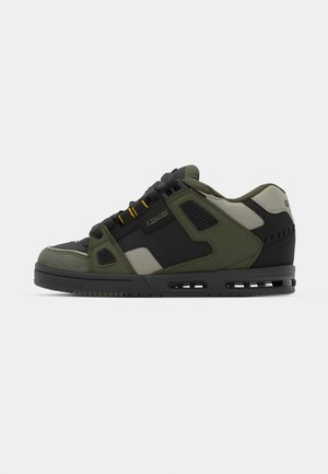 Sneakers with a black and olive green synthetic upper, featuring yellow accents, mesh panels, and a textured rubber sole.