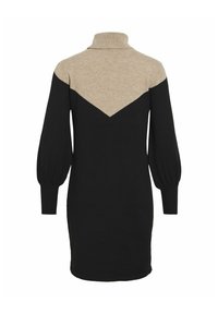 Robe en tricot avec un col haut, un corps noir et un haut beige à motif en chevrons. Manches longues bouffantes avec des poignets et un ourlet à côtes.