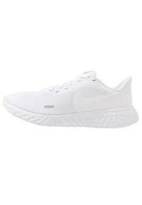Zapatilla deportiva blanca con parte superior de malla texturizada, acentos suaves y una suela ondulada acolchada. Presenta un discreto logo de Nike en el lateral.