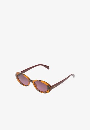 Lunettes de soleil rondes avec montures écaille ambrée et noire, branches bordeaux, verres teintés marron, marquage "KOMONO" sur la branche.