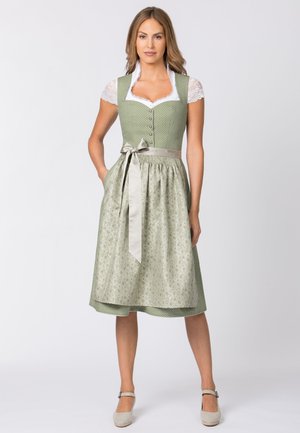 Traditional dirndl dress featuring a green dotted bodice, white lace sleeves, and a patterned, beige and green skirt with a satin ribbon tie.