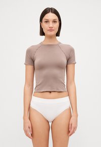 Brown short-sleeve top with a fitted design and ribbed texture, paired with white high-waisted briefs. Simple, clean lines and minimal detailing.