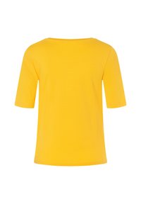 Yellow short-sleeve t-shirt in soft cotton material. Features a round neckline with a simple, unadorned design and a straight hem.