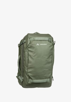 Olive green backpack made of waterproof material, rectangular shape, features multiple zippers, adjustable straps, and a logo on the front.