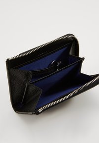 Black leather wallet with textured exterior, featuring a blue interior, multiple compartments, and a silver zipper closure.
