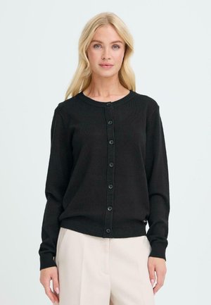 Svart cardigan i ribbad textur med långa ärmar, rund halsringning och knäppning med knappar framtill. Har matchande svarta knappar.