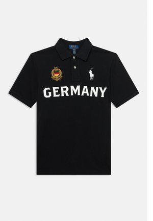 Black polo shirt with "GERMANY" in white letters, a gold and red crest on the left chest, and a white Polo Ralph Lauren logo on the right.