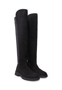 Stivali neri in suede alti fino al ginocchio con suola piatta, finitura liscia e cerniera laterale per facilitarne l'indossamento. Il design a pannelli verticali aggiunge texture.
