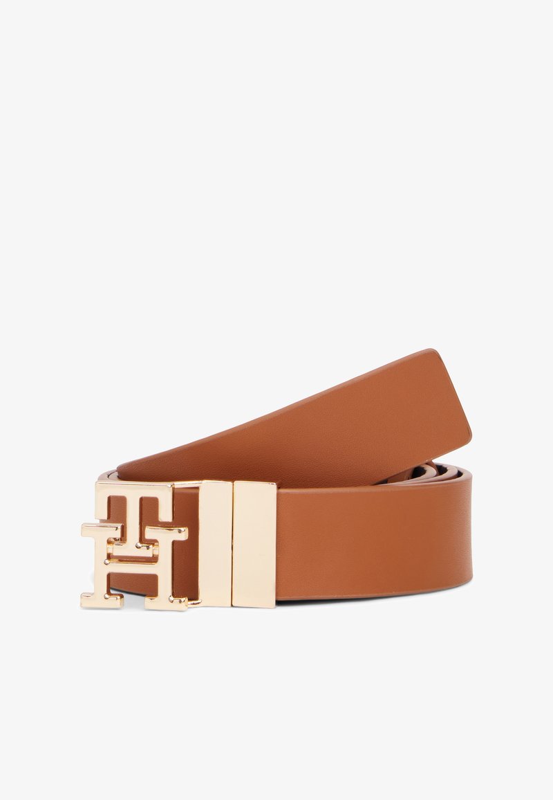 Καφέ δερμάτινη ζώνη με ομαλή υφή, με πόρπη σε χρυσή απόχρωση με διακοσμητικό μοτίβο "H" που ενώνονται μεταξύ τους και καθαρές, επίπεδες άκρες.