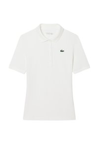 Valkoinen polo-paita, jossa on lyhyet hihat, kaulus ja kolmipainikepusero. Vasemmassa rinnassa pieni vihreä Lacoste-logo.
