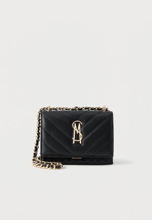 Black quilted leather crossbody bag with gold chain strap and gold MD logo on front flap, against plain white background.