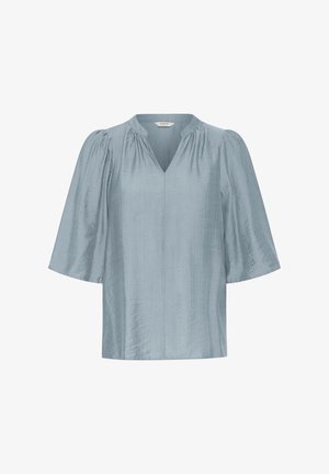 Šviesiai mėlyna trumpomis rankovėmis bluzonė su V formos iškirpte ir surinkimais peties srityje, pagaminta iš minkštos, šiek tiek tekstūruotos medžiagos.