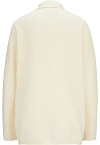 Chemise à enfiler de couleur crème, légère, avec col, manches longues, texture côtelée et coupe décontractée. Aucun élément visible de quincaillerie ou d'accent.