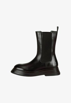 Zwarte leren enkellaarsjes met elastische zijpanelen, een ronde neus en een dikke gelaagde zool. Glad oppervlak met minimale hardwaredetails.