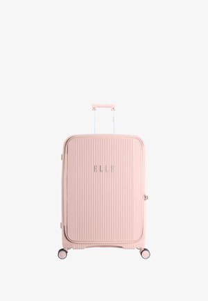 Pink hard-shell suitcase with vertical ribbing, a retractable handle, four spinner wheels, and logo detail on the front.