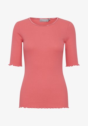 Kratka piedurkne, ribota blūze korallkrāsā ar noapaļotu kakla izgriezumu un viļņotiem malām, kas izgatavota no mīkstas auduma, lai nodrošinātu komfortu un vienkāršu valkāšanu.
