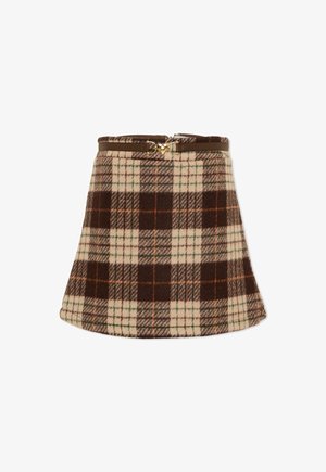 Jupe en laine forme trapèze avec un motif à carreaux marron, crème, orange et vert, dotée d'une ceinture marron avec une boucle dorée en forme de cœur.