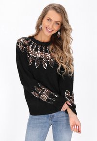 Maglione nero a maglia con un design floreale in paillettes bronzee e argentate sul petto e sulle maniche. Tessuto morbido e vestibilità rilassata.