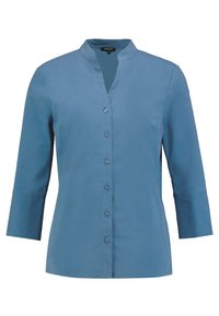 Blauwe v-hals, langemouwen shirt met zeven knopen aan de voorkant, gemaakt van een gladde stof; heeft een iets gestructureerde pasvorm en geen kraag.
