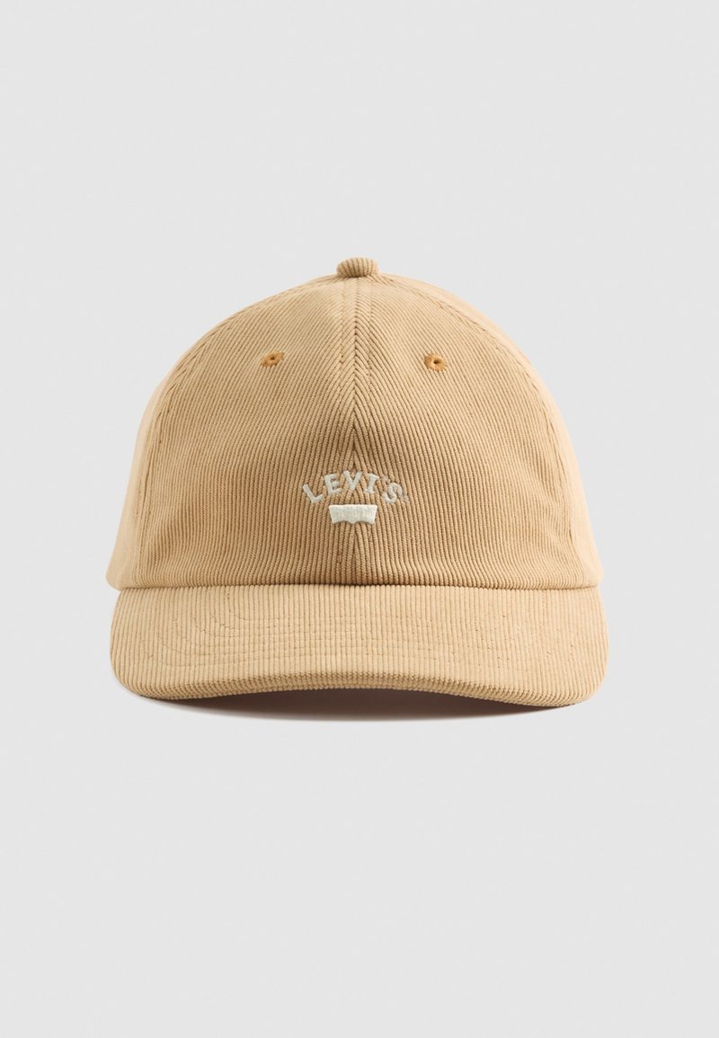 Tan corduroy cap with a curved brim and embroidered “LEVI'S” logo on the front. Features six ventilation holes, seamless design.