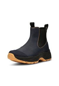 Botas de tobillo impermeables de color azul marino, con un upper de cuero suave, lados elásticos y costuras marrones, que presentan una suela de goma texturizada con motas.