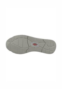 Semelle de chaussure en caoutchouc gris avec un motif de traction composé de rainures et de crêtes, présentant un logo oval au centre.
