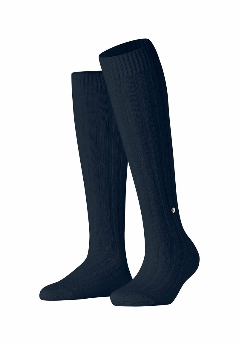 Calze a coste fino al ginocchio di un blu scuro, realizzate in un materiale morbido con una texture liscia e un piccolo logo vicino al polsino.